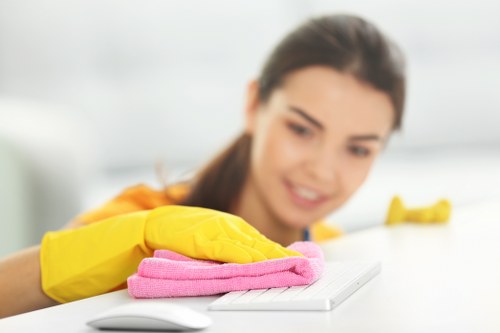Upholstery cleaning equipment being used on a fabric sofa