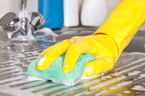 Cleaner maintaining a kitchen during a Crystalpalace regular clean